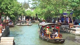 Video : China : A walk through ZhuJiaJiao 朱家角 water town ZhūJiāJiǎo is an ancient water town now situated in the outskirt of ShangHai municipality.  The town has 36 beautiful bridges dating from the Ming and Qing dynasties. 